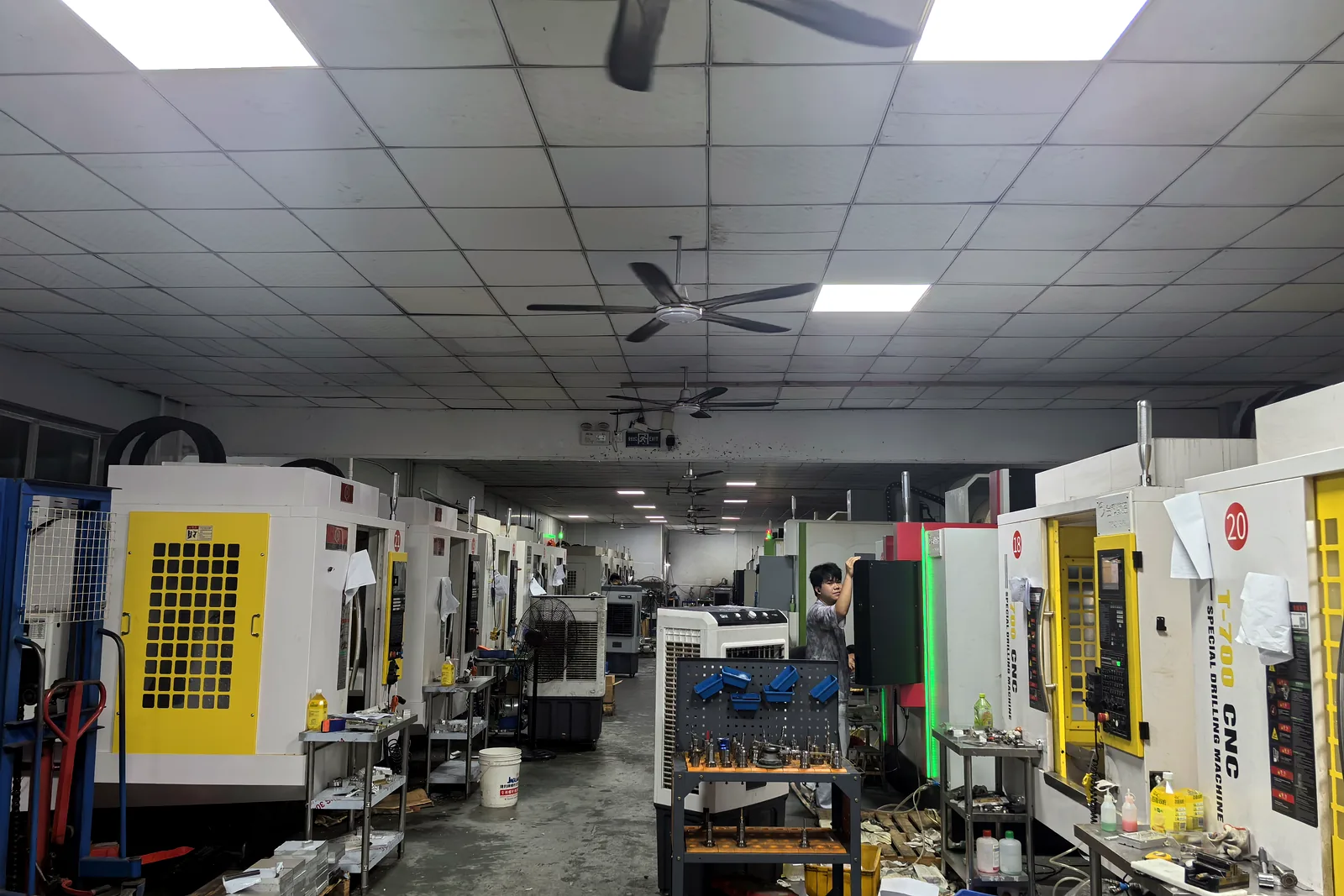 Production aisle and CNC machines inside the One Part CNC factory
