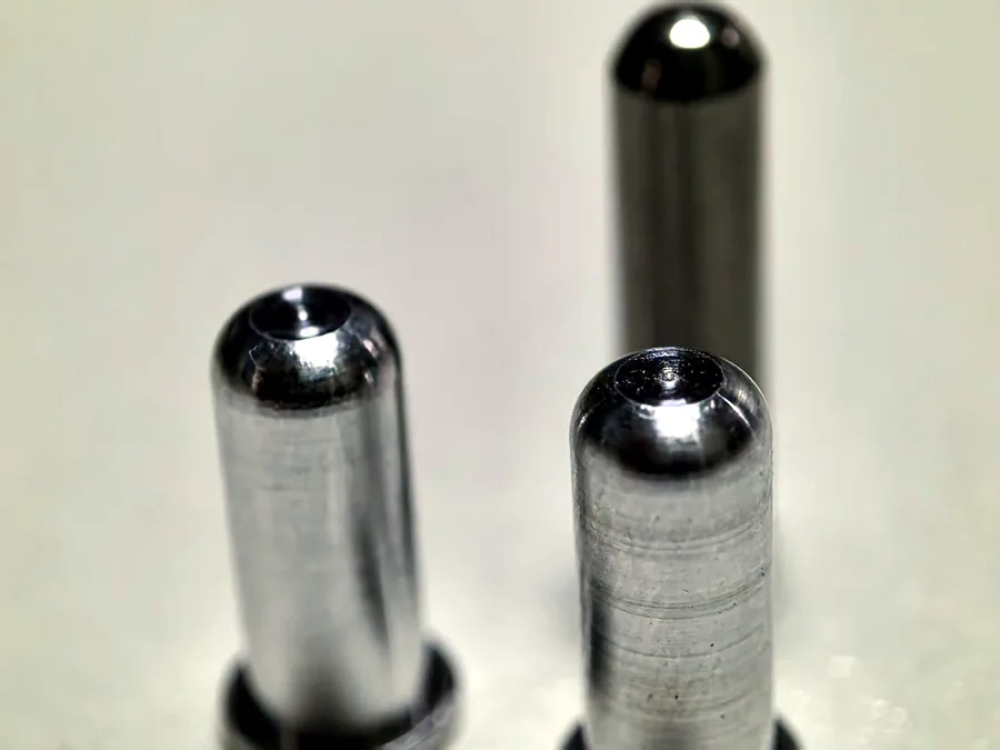 Precision machined stainless steel pins with small controlled features
